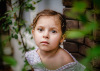 portrait-of-young-girl-with-leaves-in-the-foreground-by-Anita-Perminova.jpg