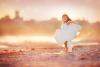 girl-holding-her-dress-while-she-twirls-by-Tracy-Sweeney-of-Elan-Studio.jpg